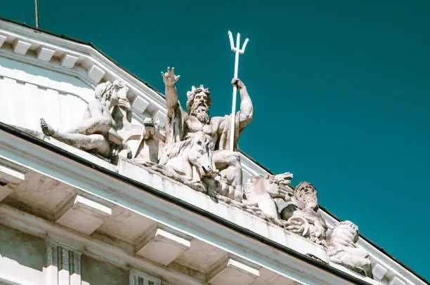 Greek God Poseidon And His Trident Statue On Stock Exchange Building In St. Petersburg, Russia