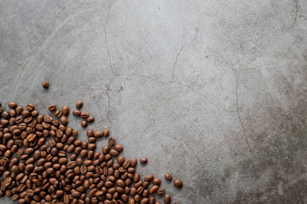 istock coffee bean on black wooden floor background. top view. space for text 1310274067