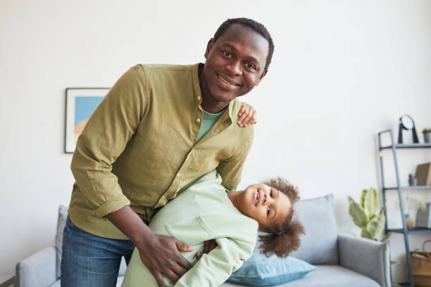 istock Happy African American Dad Playing with Daughter 1310274235