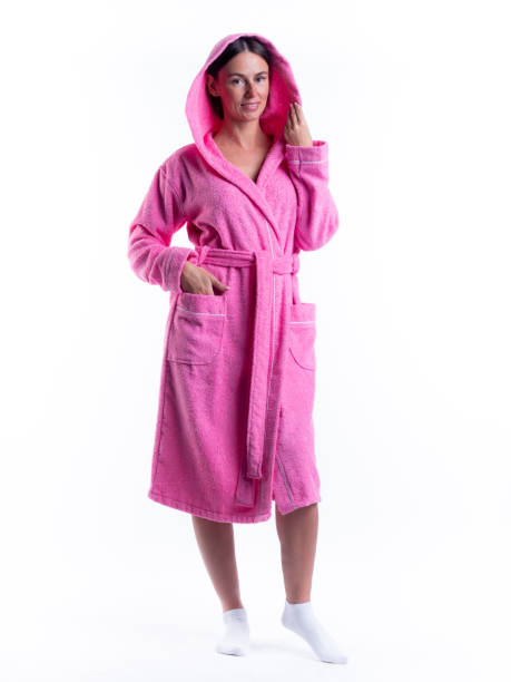 istock woman in a Bathrobe on an isolated white background with a smile on her face. 1310280549