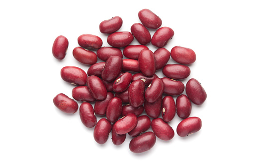 macro Close-up of Organic Rajma,  (Laal Lobia ) or red kidney beans dal cleaned on a white background. Top view