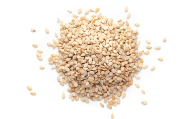istock Macro Close up of Organic White Sesame seeds(Sesamum indicum) or white Til with shell cleaned on a white background. 1310281091
