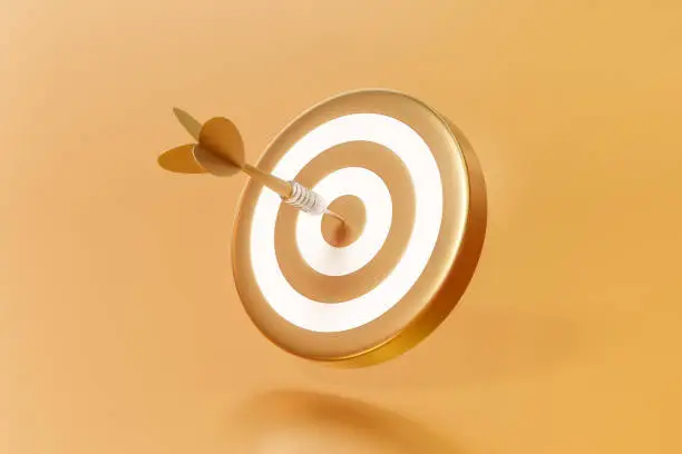 Golden arrow aim to dartboard target or goal of success on business background with complete achievement concept. 3D rendering.