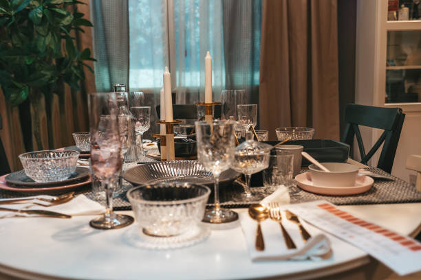 istock Restaurant. An elegantly laid dining table with dishes and cutlery for several people. Close up. Nobody 1310281842