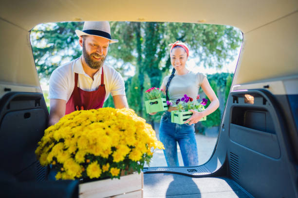 istock Florist placing flowers in client's car 1310282679