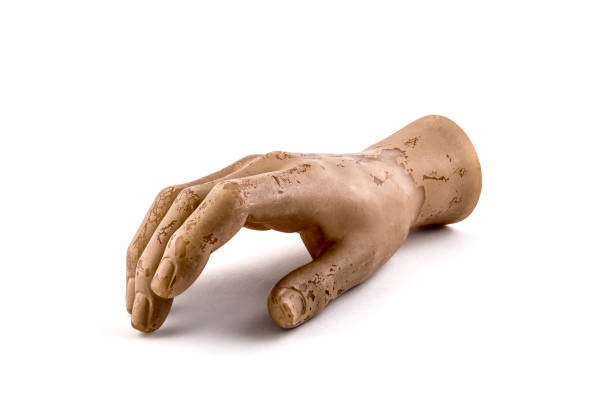 front view closeup of black marble statue hand with broken index finger reaching out isolated on white background