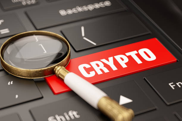 Crypto Currency Research Concept with Keyboard and Magnifier stock photo