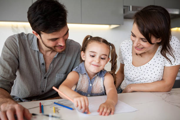 istock Family drawing together in the kitchen 1310285151