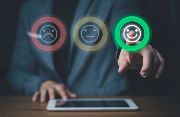 istock Businessman using smartphone and pushing smile button for the best evaluation , customer satisfaction concept. 1310287755