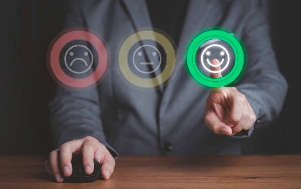 istock Businessman using computer mouse and pushing smile button for the best evaluation , customer satisfaction concept. 1310288153