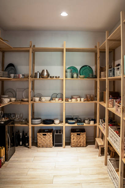 istock Containers and crockery arranged on wooden shelves 1310289416