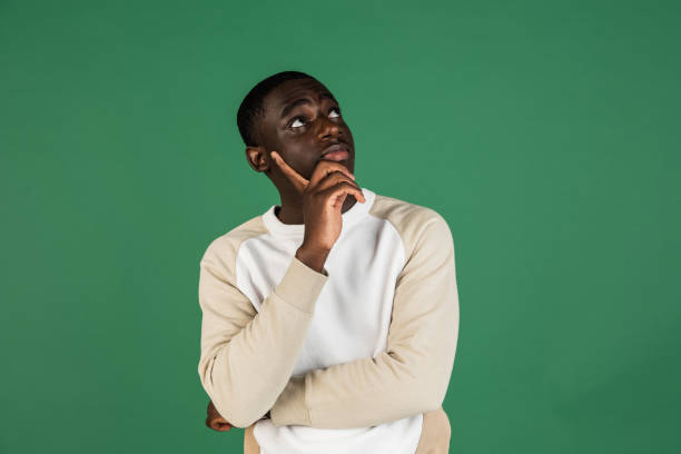 istock African man's portrait isolated on green studio background with copyspace 1310289635