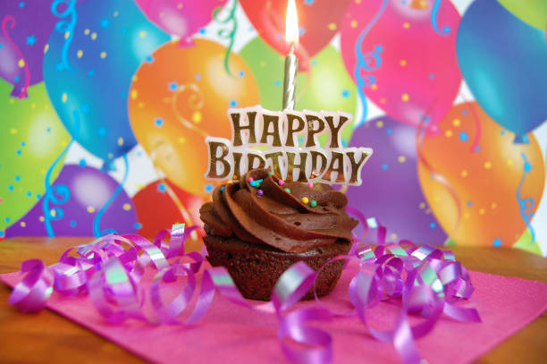 istock Happy Birthday Cupcake with Gold Candle 1310290495