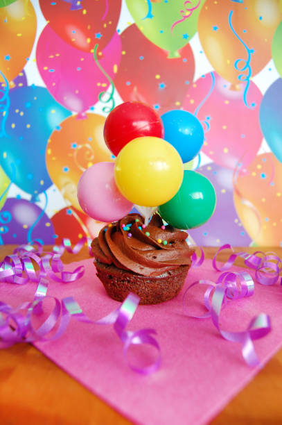 istock Happy Birthday Cupcake with Balloons 1310290719