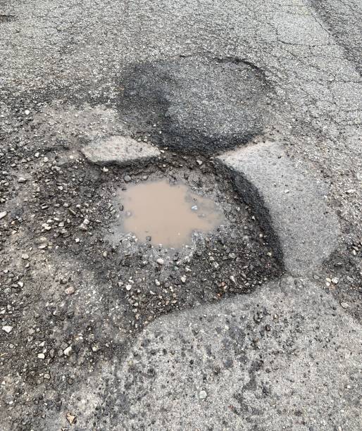 istock Pothole on Asphalt Street 1310294569