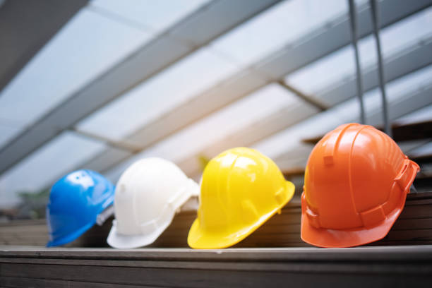 Safety Construction Worker Hats Blue, white, yellow, orange. Teamwork of construction team must have quality. Whether it engineer, construction workers. Have a helmet to wear at work. Safety at work.