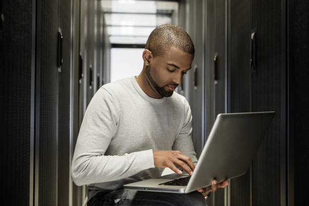istock A black male server room technician working at business reopening 1310295451