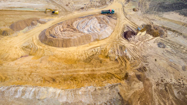 istock Gravel and sand open pit mining, sand hills - aerial view 1310295870