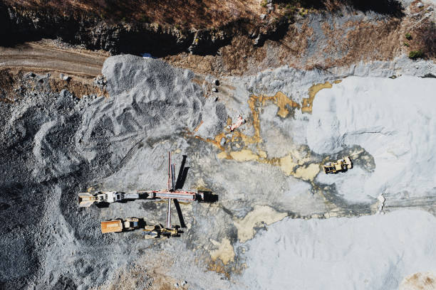 Aerial View of Gravel Quarry Looking down on a gravel quarry with rock crusher & equipment. open pit mine photos stock pictures, royalty-free photos & images