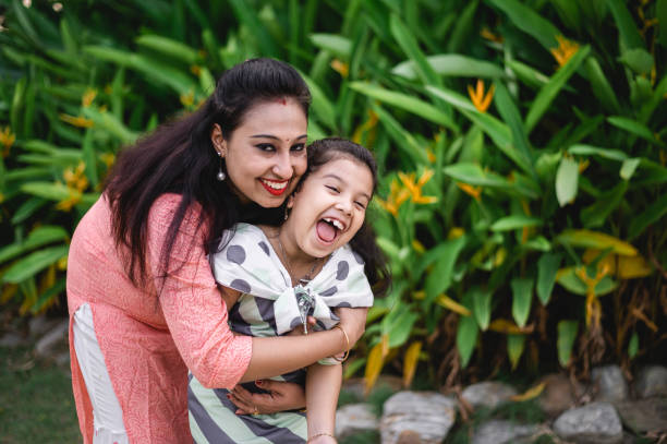 istock Mother and daughter having fun at nature park. 1310298497