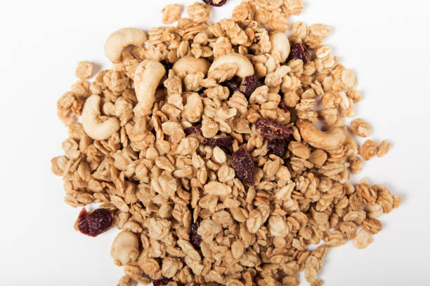 istock organic granola with nuts,cranberry and raisins on the white background 1310298735