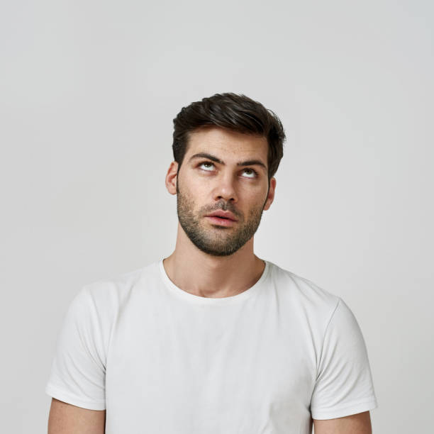 istock Man wearing t-shirt rolling his eyes 1310299463