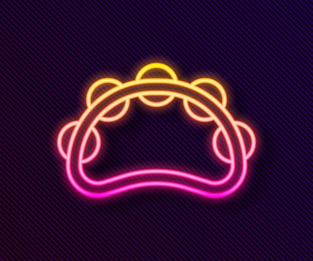 istock Glowing neon line Musical instrument percussion tambourine, with metal plates icon isolated on black background. Vector 1310299637