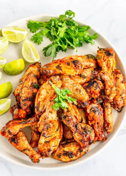 Baked Cilantro Lime Chicken Wings with Fresh Lime and Cilantro Top Down Photo