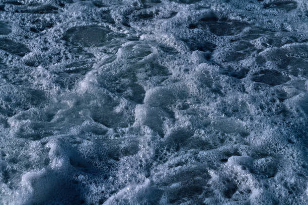 istock White foam on the sea as an abstract background 1310302659