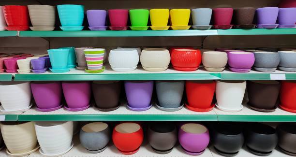istock Many colorful ceramic and plastic flower pots at shop 1310303554