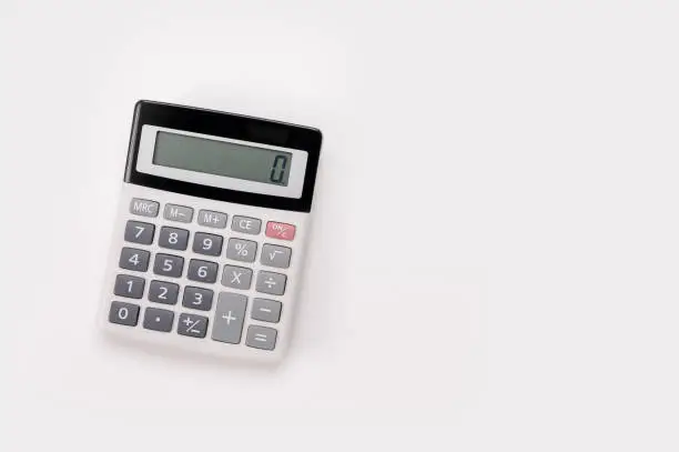 Photo of White digital calculator on the top view isolated on white background. Directly Above Shot Of Calculator On white Background