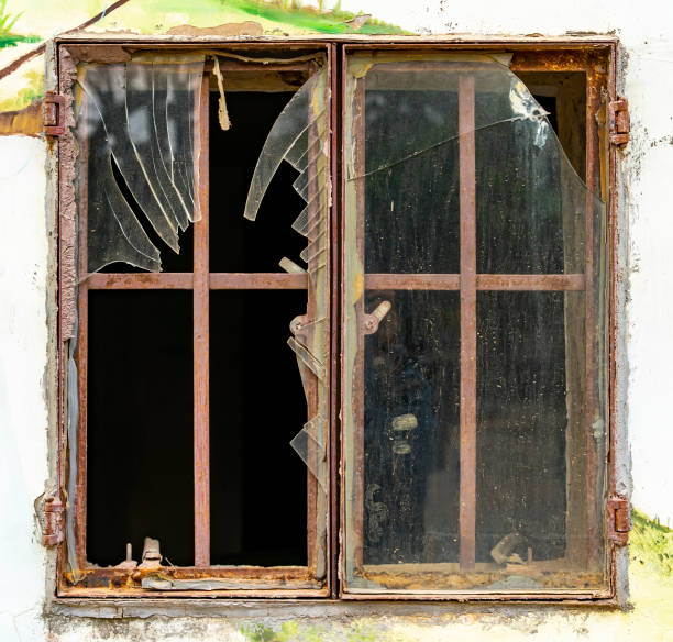 istock building with broken windows on Grunge Abstract Background 1310305074