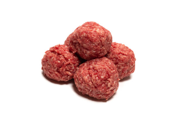 istock Raw meat balls isolated on white background. 1310305094