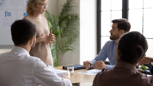 istock Diverse businesspeople discuss ideas at team meeting 1310305888