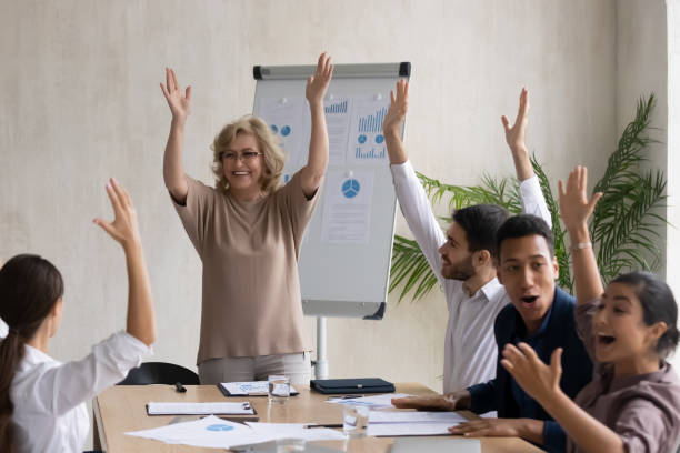 istock Excited diverse businesspeople take part in training in office 1310305919