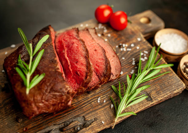 istock Grilled beef steak with spices on stone background 1310306816