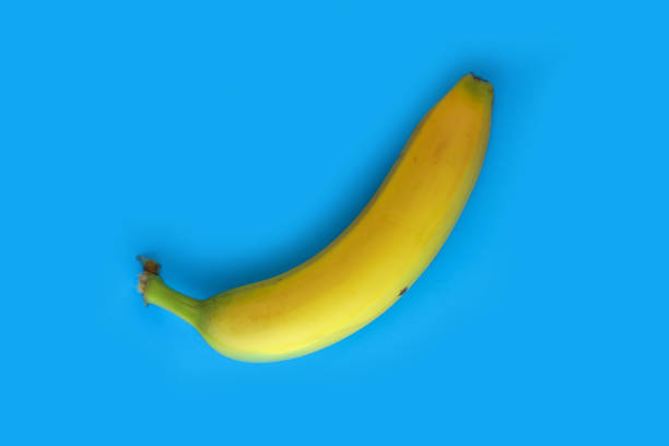 istock Isolated banana on a blue background 1310308635