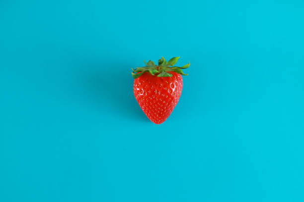 istock Strawberries isolated on a blue background 1310309417