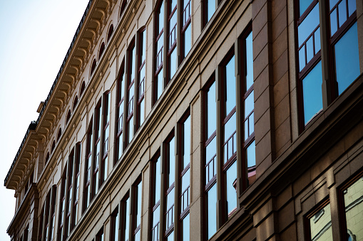 Modern architechture. Urban cityscape. Offices and workshops with big glass surfaces and windows. Like office and school.