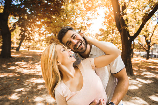 istock Happy couple in love walking in park 1310314515