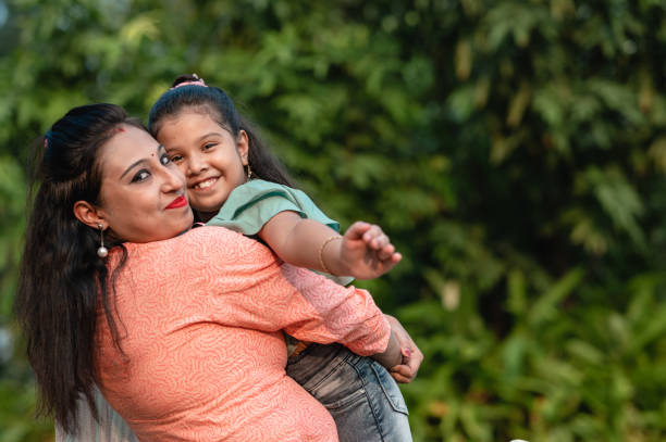 istock Mother and daughter having fun at nature park. 1310315371