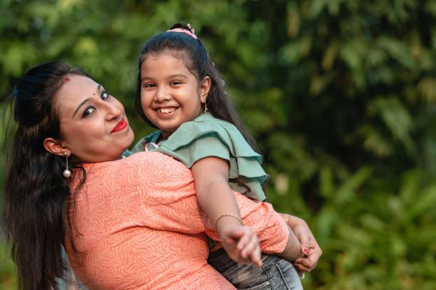 istock Mother and daughter having fun at nature park. 1310315397