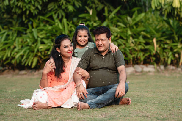 istock Happy family heaving fun in the park. 1310315737