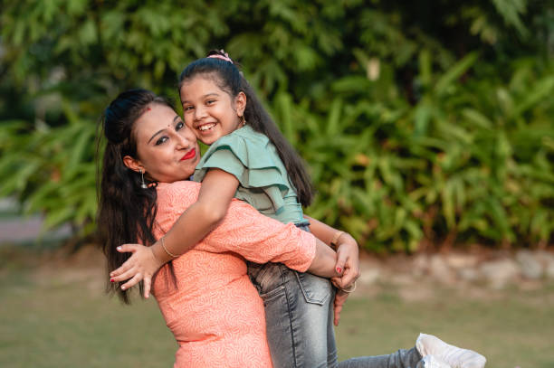 istock Mother and daughter having fun at nature park. 1310315748
