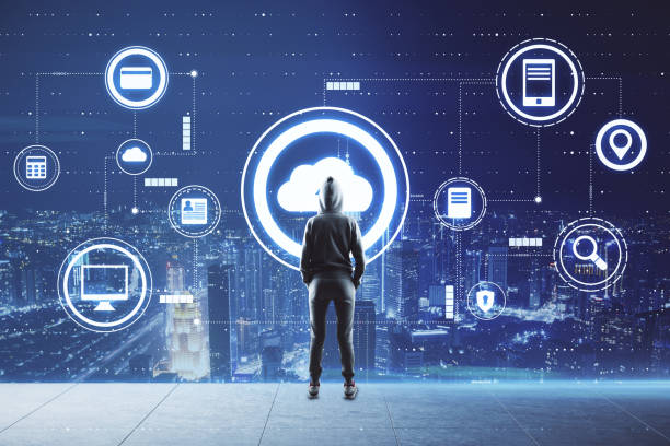 istock Man looking at hologram cloud icon, city view in the background 1310315791
