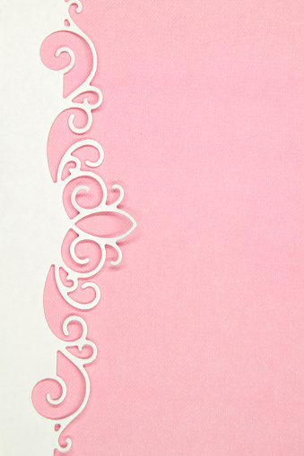Floral frame on pink paper background