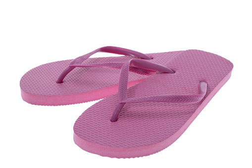 Pink flip flops on a white background
