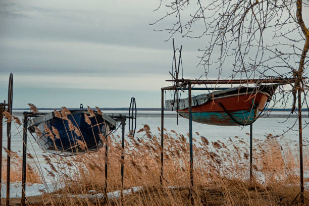 istock Two old boats on the lake 1310318101