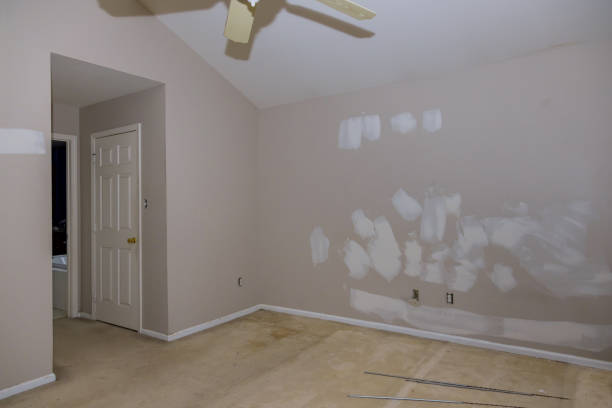 istock Wall with damage spreading plaster to damaged wall, repairing works 1310318299