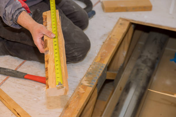 istock Framing contractor measuring for wooden beam 1310318302